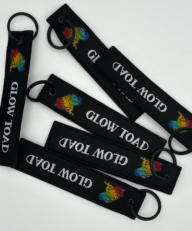 GLOW TOAD FLIGHT TAG KEYCHAIN: CARRY THE GLOW